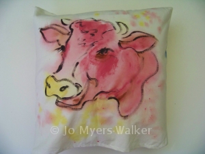 Bossy tries on some colors (painted pillow by Jo Myers-Walker)