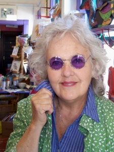 Jo Myers-Walker in round tinted glasses