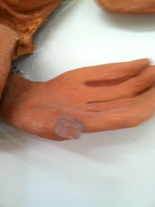 Terra cotta Story Wall figure with missing digit