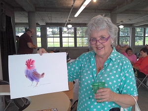 Jo with painting done at Iowa State Fair demonstration