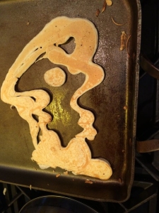 Drawing created with pancake batter on a griddle