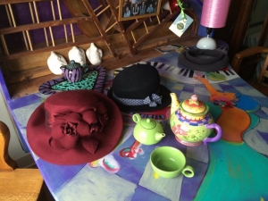 Hats arranged with tea set