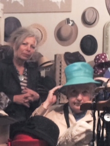 Jo Myers-Walker trying on a hat at La Boutique de Maman