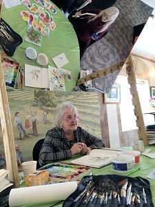 Jo Myers-Walker showing painting technique at Summerset Winery with demonstration mirror overhead