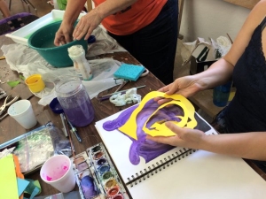 Brightly-colored spirals create a 3-D effect in a journal under construction