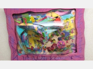 Colorful town depicted in varying levels of paper