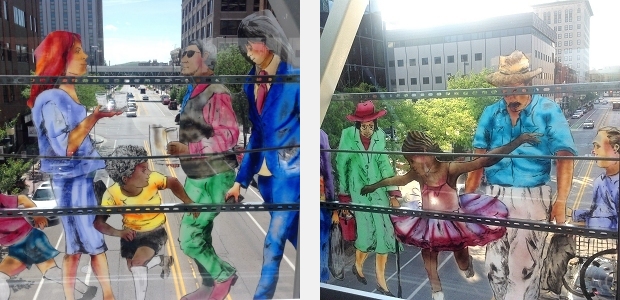 Detail of figures from sculpture by Jo Myers-Walker viewed from inside Cedar Rapids skywalk