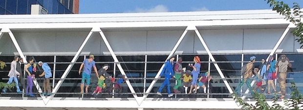 View of one side of Cedar Rapids skywalk with sculpture by Jo Myers-Walker