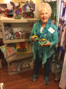 Artist Jo Myers-Walker with slumped-acrylic sculpture of a shoe