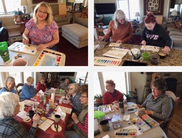Artists painting at a watercolor workshop facilitated by Jo Myers-Walker