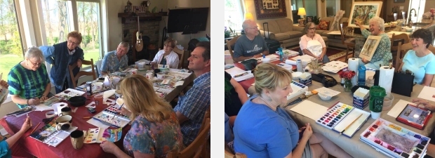 Artists at work around a table during watercolor workshops near Nevada, Iowa