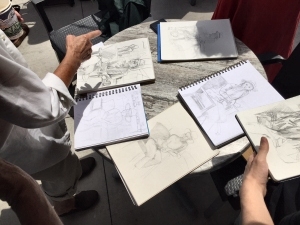 Pencil sketches of a model drawn by various artists