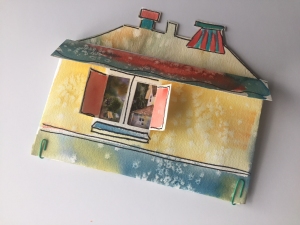 Watercolor painted pouch made in the shape of a house