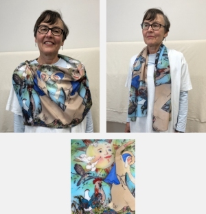 Model wearing scarf printed with detail of St. Clare from Canticle of Creation sculpture by Jo Myers-Walker