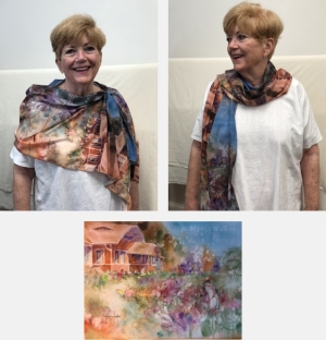Model wearing scarf printed with images of watercolor painting Nikki's House by Jo Myers-Walker