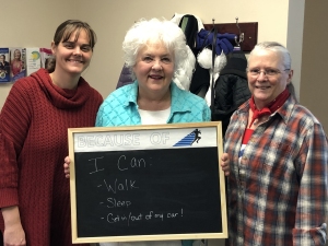 Jo Myers-Walker poses with physical therapists Brittany and Lori