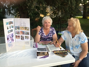 Jo Myers-Walker and fellow artist Jeanette at South Amana Swap Meet