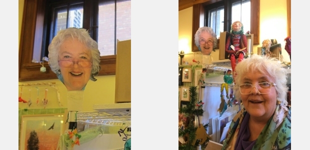 Artist Jo Myers-Walker poses with a cardboard likeness at her booth at Eastisde Artists Show and Sale 2019 in Iowa City