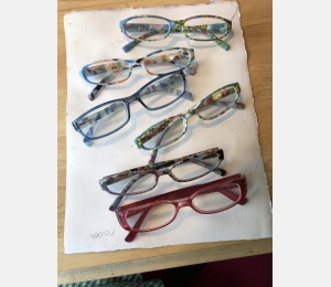 An assortment of brightly colored glasses used by Jo Myers-Walker over the years