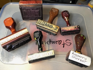 A variety of well-used ruber stamps with wooden handles